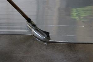 Epoxy Flooring being applied with a squeegee
